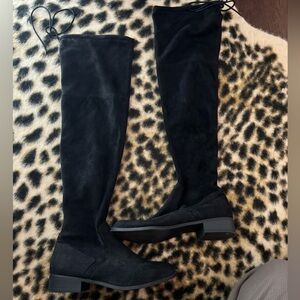 Knee High Black boots.